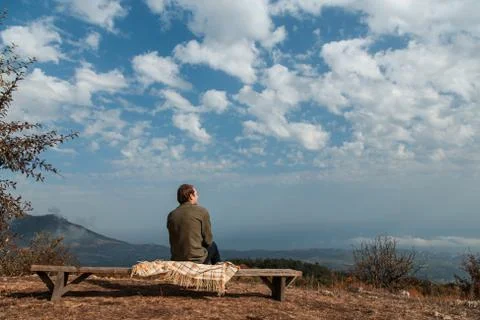 Man sitting on a rock Stock Photos