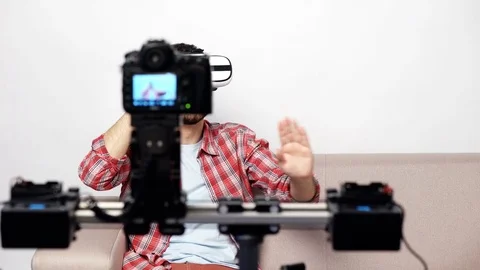 Man sitting on the sofa smiling at camera Stock Footage 74911255