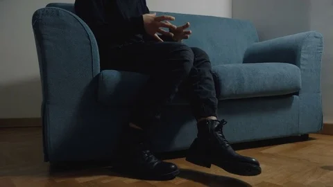  Man Sitting On Sofa Talking To His Therapist.depression, anxiety, panic Stock Footage 82733534