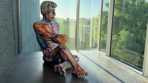 Man Sitting Statue at Phoenix Art Museum Stock Footage 325562485