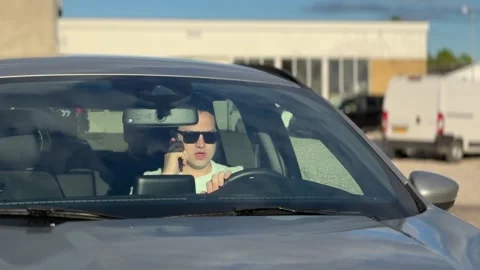 Man sitting at steering wheel driving car Stock-Footage 336748684