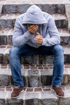 Man sitting on steps Stock Photos