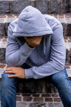 Man sitting on steps Stock Photos