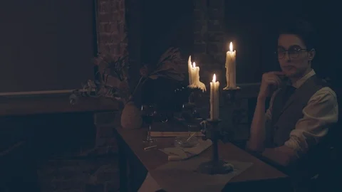 Man sitting at table with candles Stock Footage 124407918