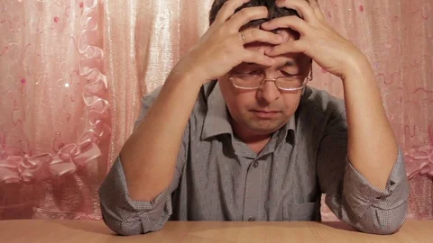 Man sitting at a table upset. Stock Footage 69723513