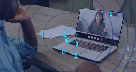 Man sitting table watching laptop call as woman starting demo, binary overlay 스톡 동영상 331270025