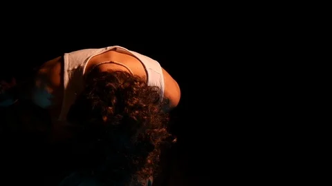 Man sitting is thinking to himself. contemplation. studio shot in black backgrou 스톡 동영상 126861881