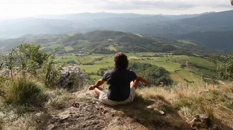 Man sitting at the top of a mountain Stock Footage 41433548