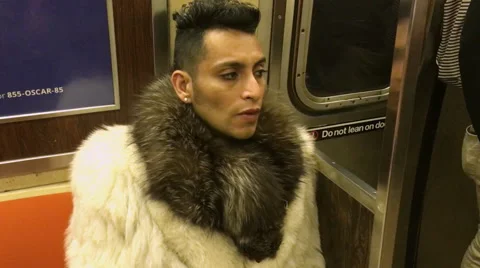 Man Sitting on Train In Fur Coat, NY Subway Stock Footage 58654330