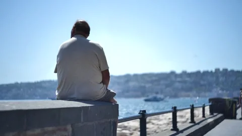 Man Sitting On A Wall Video stock 250395837