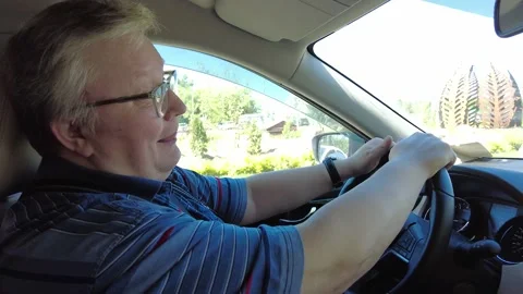 Man sitting at the wheel of a car Видео 233274018