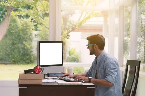 Man sitting working with the computer. Stock Photos