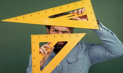 Man with size measured on triangle ruler math tool, school stem disciplines 스톡 사진
