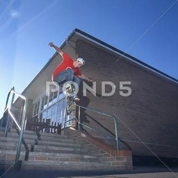 Man on skateboard jumping, mid-air Stock Photos