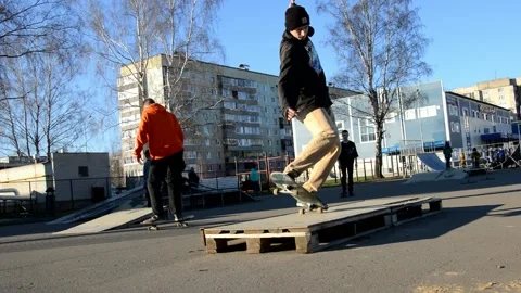 Man on skateboard performs a trick Stock Footage 131128212