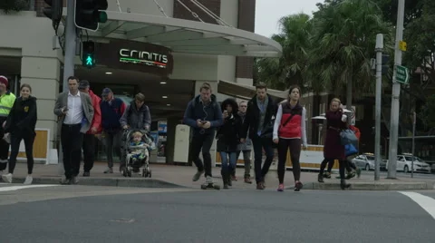 Man skateboarding across the road using his smart phone Stock Footage 68095367