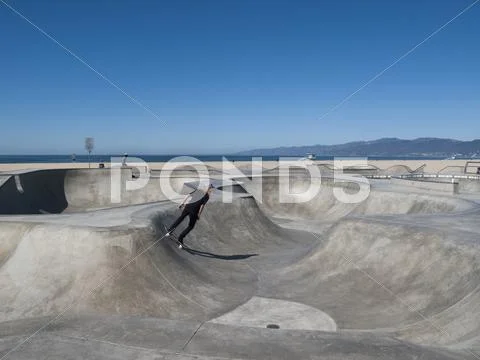 Man Skateboarding In Skateboard Park, Venice Beach, California