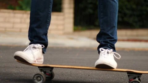 Man skateboarding skating around empty suburb street alone relaxing and joyful Stock Footage 154760475