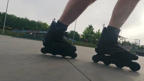 Man skates on roller blades in extreme park Stock Footage 276119033