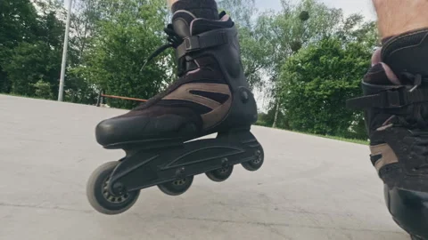 Man skates on roller blades in extreme park Stock Footage 309333324