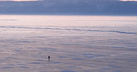 Man Skating On The Surface Of The Ice-covered Lake Stock-Footage 104198239