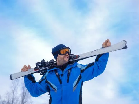 Man with a ski make having rest before next downhill skiing. Stock Photos