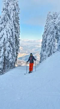 Man skier portrait with mountains on background Stock Photos