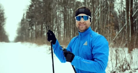Man skier in a snowy forest. Close-up. Athlete training in a winter forest. Stock Footage 294683091