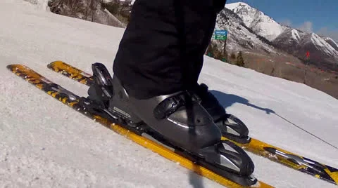 Man skiing across snow Stock Footage