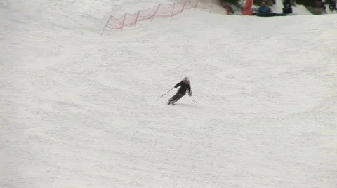 Man skiing down mountain  Stockbeeldmateriaal 90487