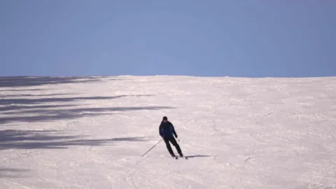 Man skiing down the mountain Stock Footage 188548651