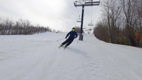 Man Skiing fast at Blue Mountain Ontario during Winter 動画素材 280272260