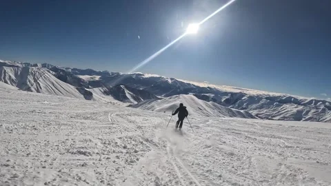 Man is skiing in on the slope of Gudauri ski resort, Georgia Stock Footage 321623655