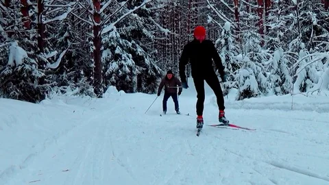 A man skiing in a winter forest Video stock 76141174