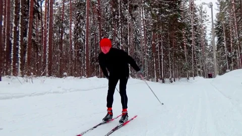 A man skiing in a winter forest Video stock 76141257
