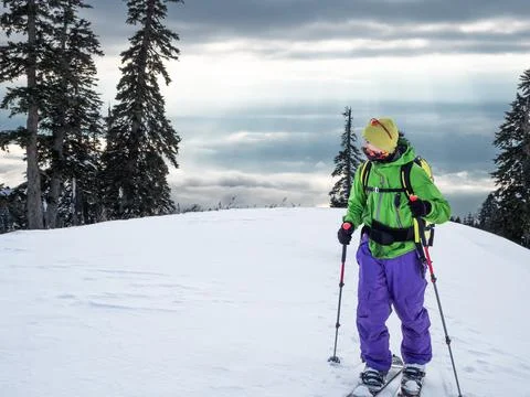Man on skis or splitboard ski touring 스톡 사진