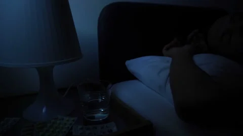 Man Sleeping Bad In Bed At Night, Suffering From Insomnia Sickness Headache Stock Footage 89573493