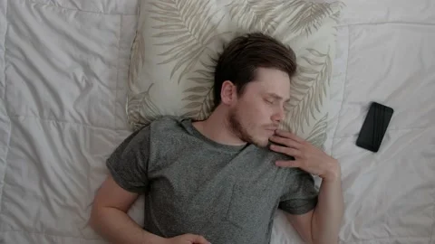 Man sleeping in bed. Stock Footage 189257460