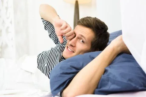 Man sleeping in bed Stock Photos