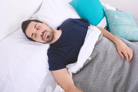Man sleeping on bed. Stock Photos