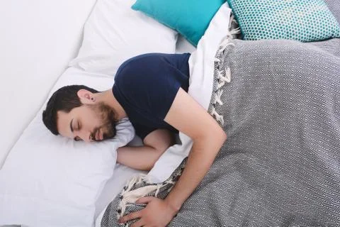 Man sleeping on bed. Stock Photos