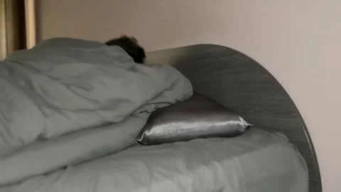 Man Sleeping in Bed Turns to the Other Side Stock Footage 310511353