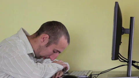Man sleeping on the computer Stock Footage 134456997