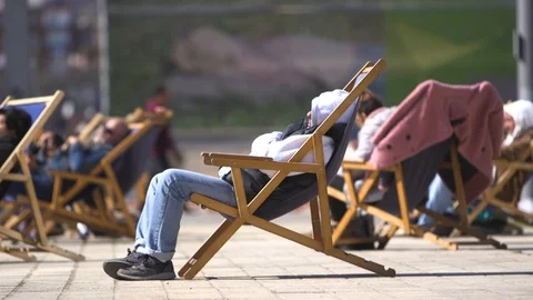 Man Sleeping In A Deck Chair In Winter Stock Footage 127100183