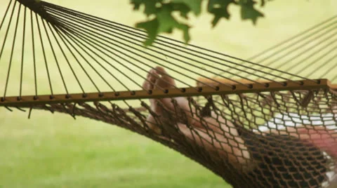 Man sleeping in a hammock Stock Footage 24701500