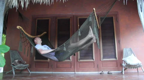 Man Sleeping in a Hammock Stock Footage 46038923