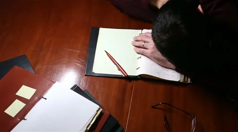 Man Sleeping on His Notes Stock Footage 59087777