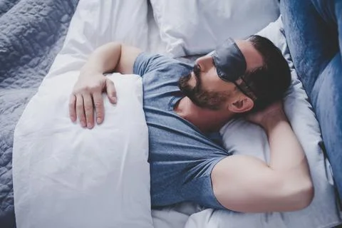 Man in sleeping mask Stock Photos