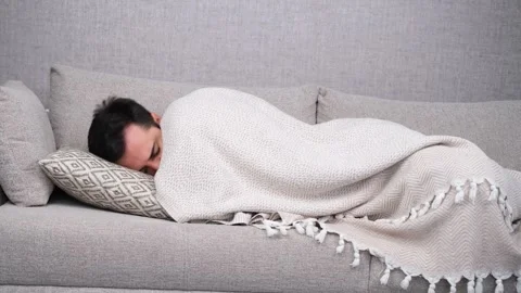 Man sleeping on sofa Stock Footage 268469346