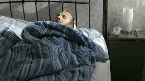 Man sleeping time laps, restless night - HD Stock Footage 22030165